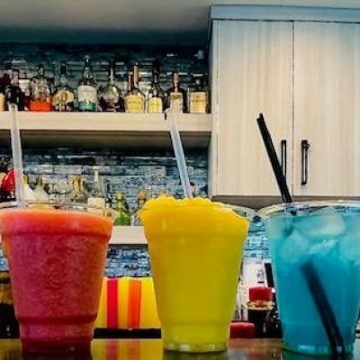 a cup of coffee and a glass of beer on a table