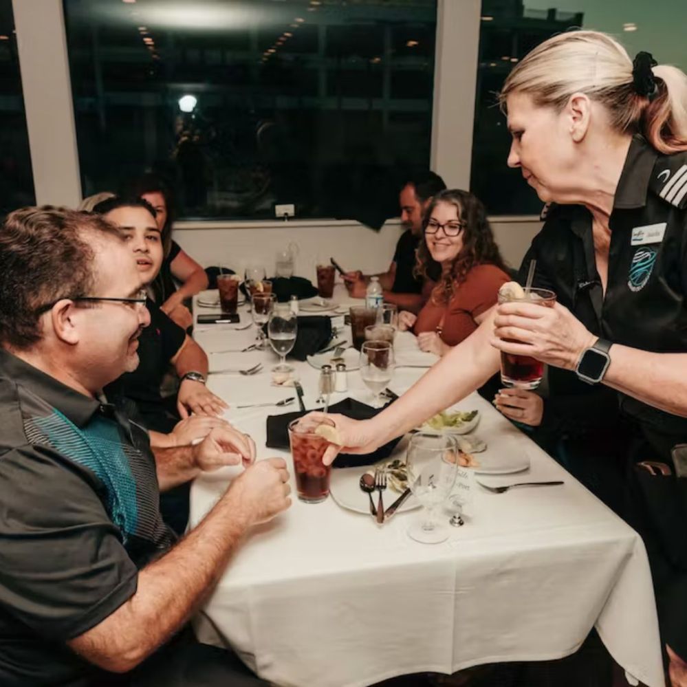 a group of people sitting at a table