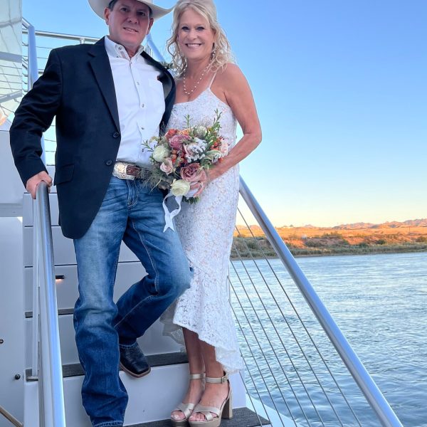 a man and a woman standing on a boat