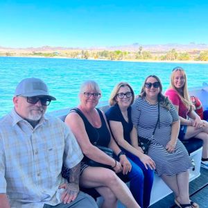 a group of people sitting on a river cruise boat