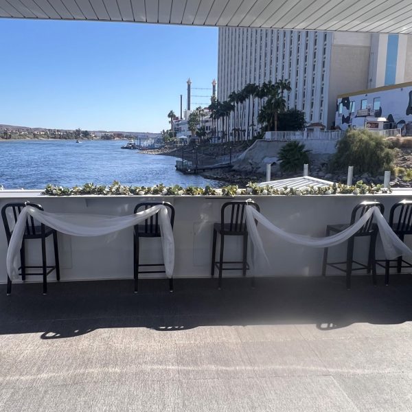 a chair sitting in front of a body of water