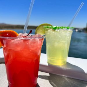 a glass of orange juice next to a cup of coffee