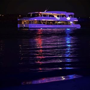 a boat that is lit up at night