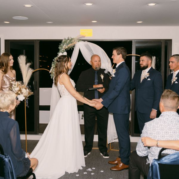 a group of people standing in front of a crowd posing for the camera
