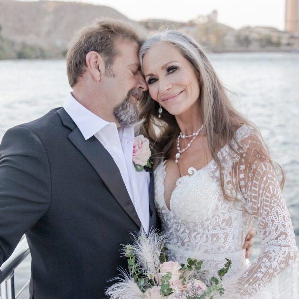 a person standing next to a body of water