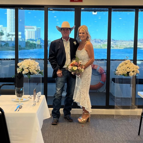 a couple of people that are standing in front of a window